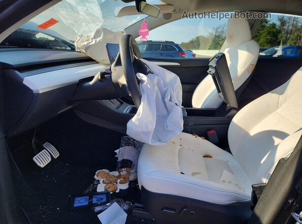 7SAYGDEF2PF968117 2023 TESLA MODEL Charcoal Front interior view