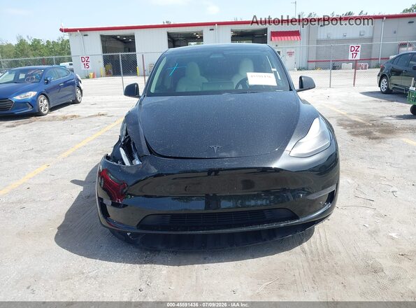 7SAYGDEF2RA296673 2024 TESLA MODEL Y Black Vista del salpicadero