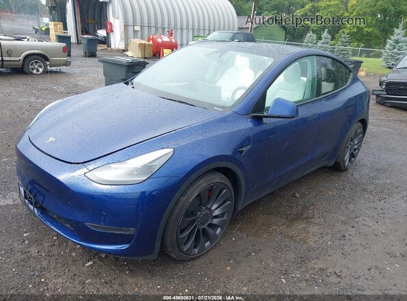 7SAYGDEF3RA268218 2024 TESLA MODEL Y Blue წინა მარცხენა ხედი სამი მეოთხედიდან