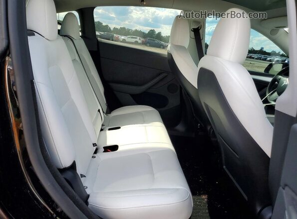 7SAYGDEF3SA343294 2025 TESLA MODEL Black Vista de los asientos traseros
