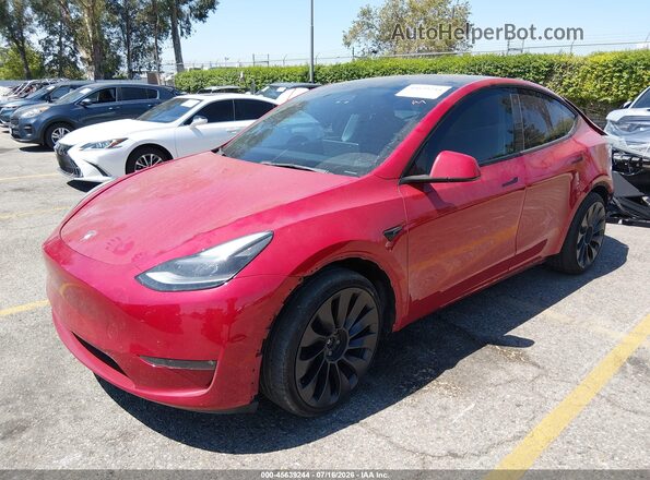 7SAYGDEF4PF606371 2023 TESLA MODEL Y Red Vista tres cuartos delantera izquierda