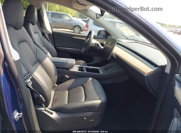 7SAYGDEF7PA049713 2023 TESLA MODEL Y Blue Вид салону спереду
