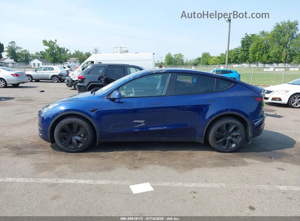 7SAYGDEF7PA049713 2023 TESLA MODEL Y Blue Вид задньої частини салону