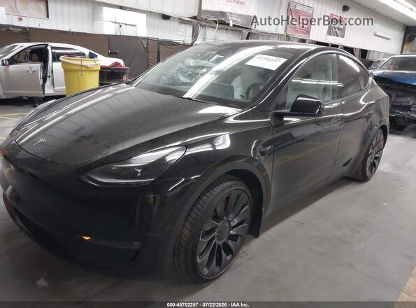 7SAYGDEF7PF913338 2023 TESLA MODEL Y Black წინა მარცხენა ხედი სამი მეოთხედიდან