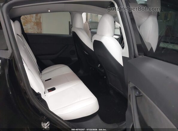 7SAYGDEF7PF913338 2023 TESLA MODEL Y Black VIN კოდის სტიკერის ხედი