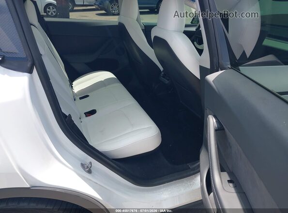 7SAYGDEF8PF702326 2023 TESLA MODEL Y White VIN կոդի պիտակի տեսք