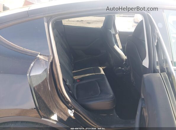 7SAYGDEF8PF875814 2023 TESLA MODEL Y Black VIN კოდის სტიკერის ხედი