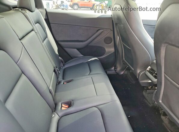 7SAYGDEFXPF763774 2023 TESLA MODEL Black Vista de los asientos traseros