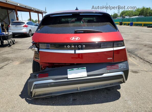 7YAKNDDC2TY044263 2026 HYUNDAI IONIQ Red უკანა ხედი