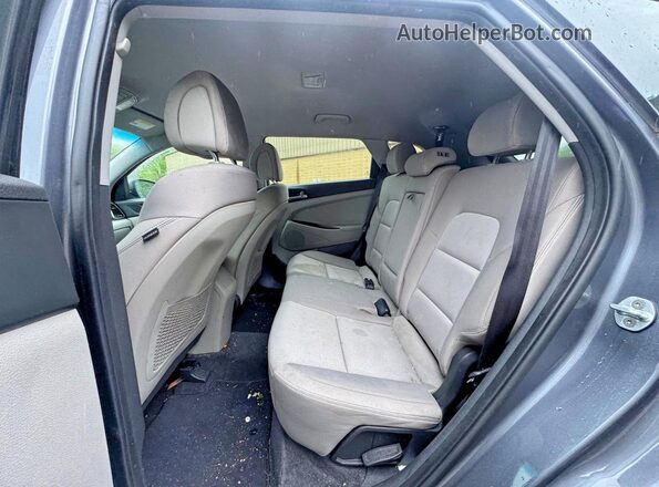 KM8J3CA2XGU194869 2016 HYUNDAI TUCSON Charcoal Front interior view