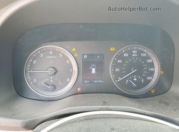 KM8J3CA20GU055382 2016 HYUNDAI TUCSON White Rear seats view
