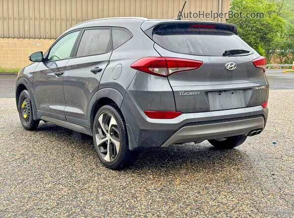 KM8J3CA2XGU194869 2016 HYUNDAI TUCSON Charcoal Front right