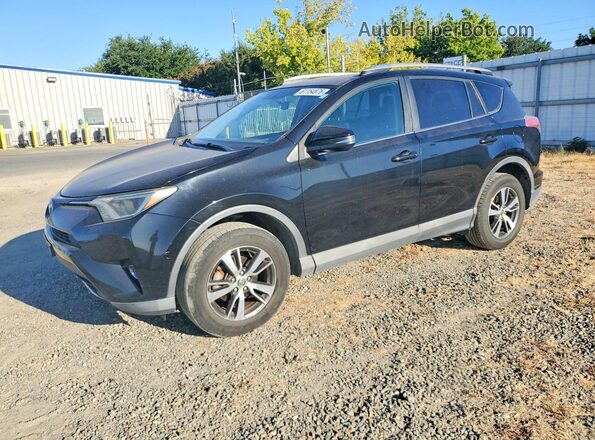 2T3RFREV2GW409394 2016 TOYOTA RAV4 Black Tył lewy