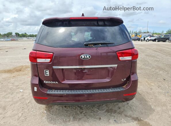 KNDMB5C16H6241163 2017 KIA SEDONA Maroon Front interior view