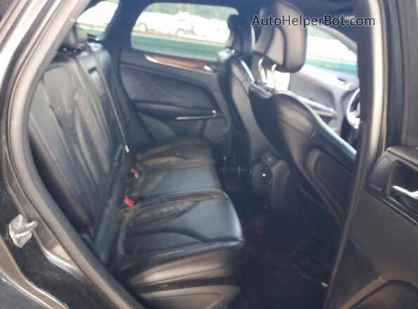 5LMCJ2C9XHUL21623 2017 LINCOLN MKC Charcoal Vista interior trasera