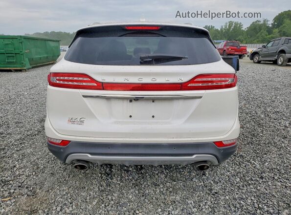 5LMCJ3C94KUL13319 2019 LINCOLN MKC Белый Вид салона спереди