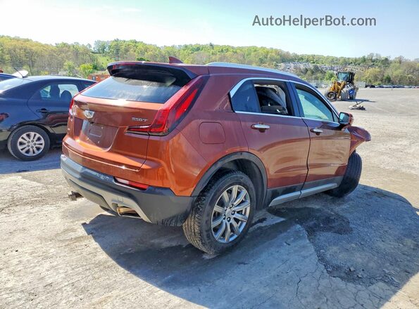 1GYFZDR45MF003793 2021 CADILLAC XT4 Orange Front right