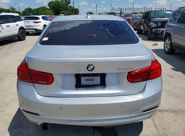 WBA8E1G57HNU13993 2017 BMW 3 SERIES Silver Вид салону спереду
