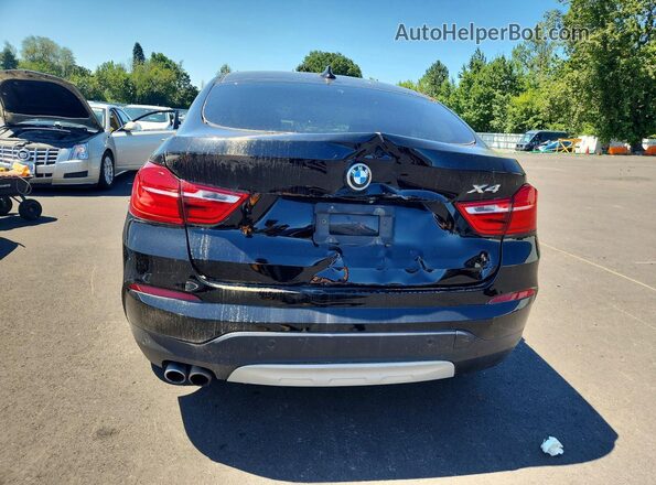 5UXXW3C51G0M90320 2016 BMW X4 Black Vista interior delantera