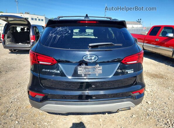 5NMZUDLB4JH104119 2018 HYUNDAI SANTA FE Black Front interior view