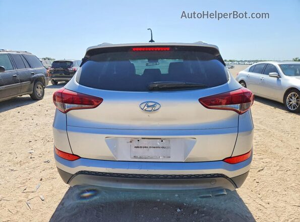 KM8J33A26GU038358 2016 HYUNDAI TUCSON Серебряный Вид салона спереди