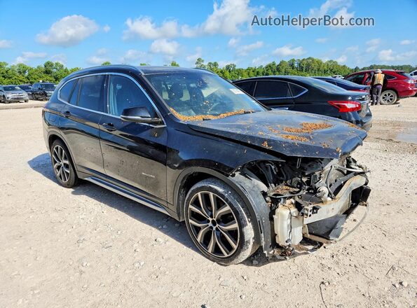 WBXHT3C34G5E55714 2016 BMW X1 Black Widok z przodu