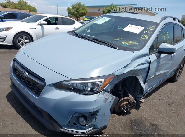 JF2GTADC4JH313749 2018 SUBARU CROSSTREK Light Blue Vista tres cuartos delantera izquierda
