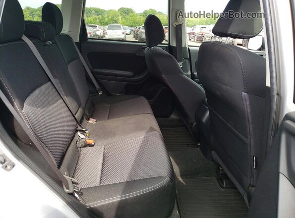 JF2SJADC1GH489540 2016 SUBARU FORESTER Silver Vista interior trasera