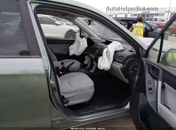 JF2SJADC7GH515381 2016 SUBARU FORESTER Зеленый Вид салона спереди