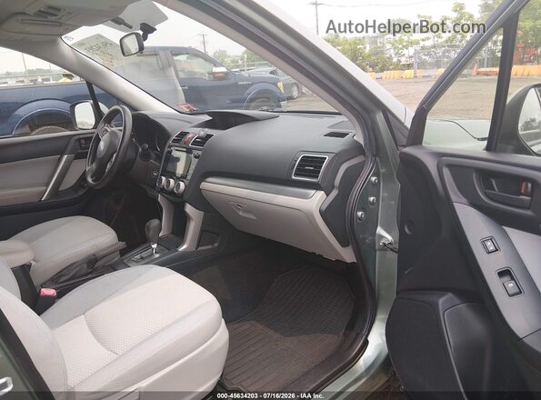 JF2SJADC8GH465378 2016 SUBARU FORESTER Зеленый Вид салона спереди