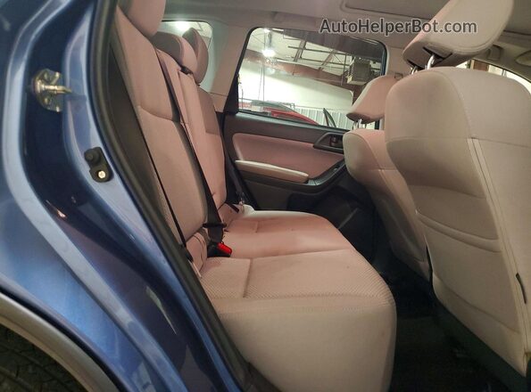 JF2SJAEC0JH508228 2018 SUBARU FORESTER Blue Vista interior trasera