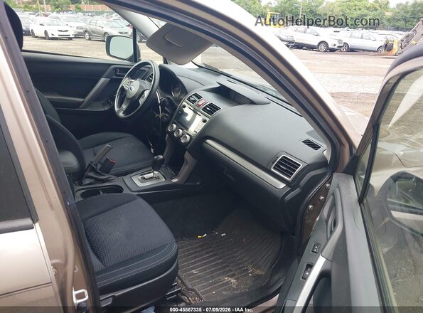 JF2SJAFC3GH520705 2016 SUBARU FORESTER Gold Widok wnętrza z przodu