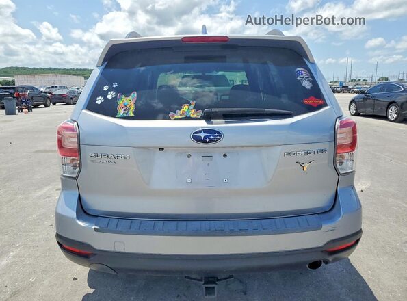 JF2SJAJC4HH465707 2017 SUBARU FORESTER Silver Rear view