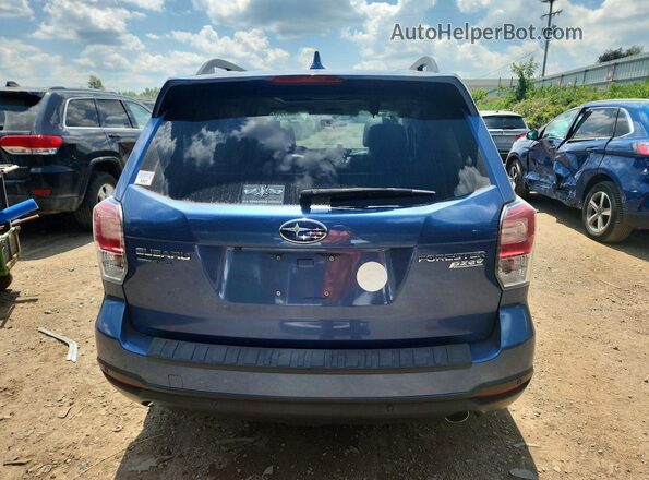 JF2SJARC9JH592141 2018 SUBARU FORESTER Blue Vista trasera