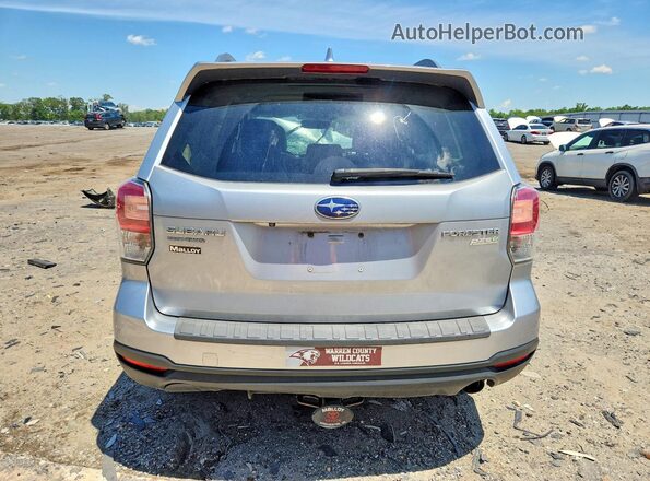JF2SJATC6HH497054 2017 SUBARU FORESTER Silver Rear view