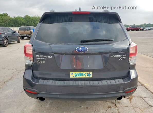 JF2SJGWC8JH596432 2018 SUBARU FORESTER Blue Rear view