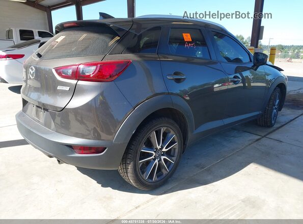 JM1DKFC77J0303978 2018 MAZDA CX-3 Gray Trasero derecho