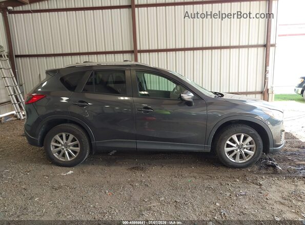 JM3KE2CY1G0629906 2016 MAZDA CX-5 Gray Vista interior trasera