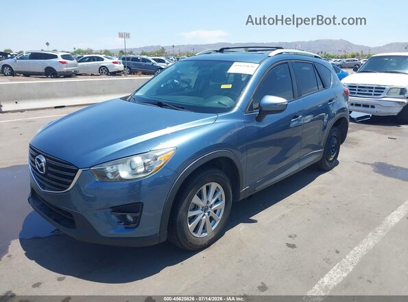 JM3KE2CY3G0629194 2016 MAZDA CX-5 Blue Առջևի ձախ երեք քառորդ տեսարան