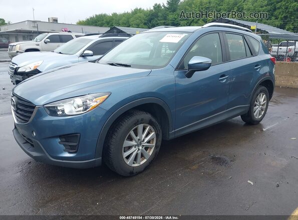 JM3KE4BY5G0769227 2016 MAZDA CX-5 Light Blue Vista tres cuartos delantera izquierda