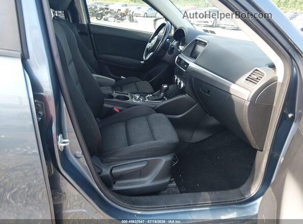 JM3KE4CY2G0788039 2016 MAZDA CX-5 Blue Widok wnętrza z przodu