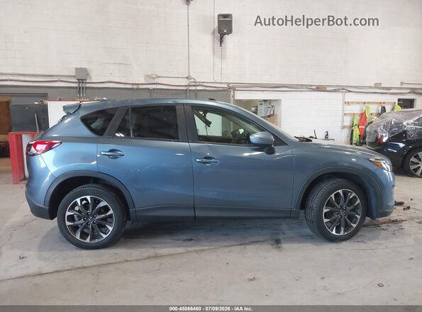 JM3KE4DY2G0713906 2016 MAZDA CX-5 Blue Rear interior view