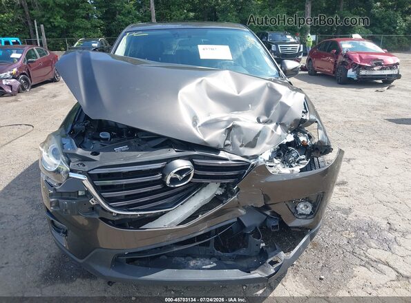 JM3KE4DY4G0904484 2016 MAZDA CX-5 Brown Instrument cluster view