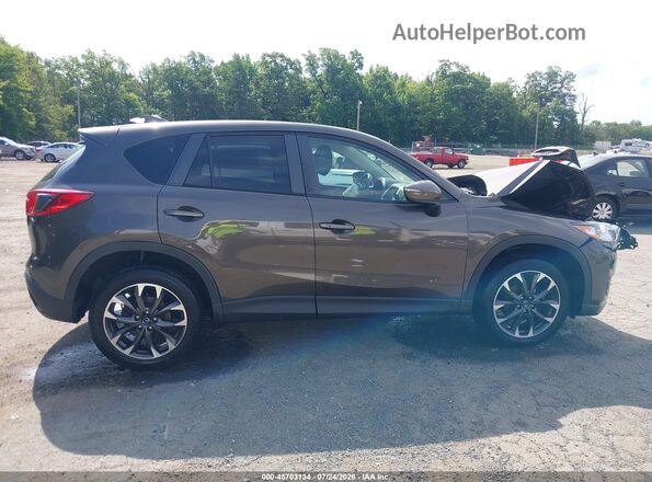 JM3KE4DY4G0904484 2016 MAZDA CX-5 Brown Rear interior view