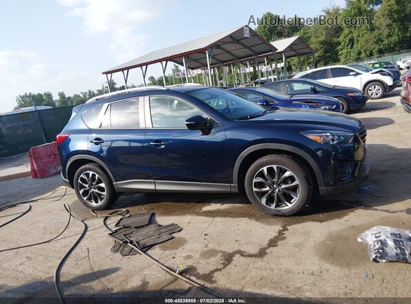 JM3KE4DY9G0908692 2016 MAZDA CX-5 Blue Rear interior view