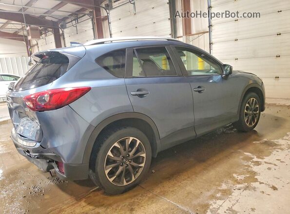 JM3KE4DYXG0641014 2016 MAZDA CX-5 Blue Trasero derecho