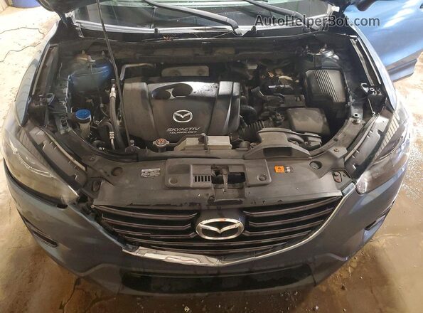 JM3KE4DYXG0641014 2016 MAZDA CX-5 Blue Vista del compartimento del motor