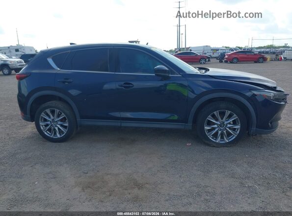 JM3KFADM7M1320627 2021 MAZDA CX-5 Dark Blue Vista interior trasera