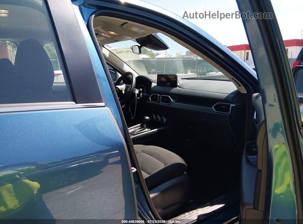 JM3KFBAM7P0182673 2023 MAZDA CX-5 Blue Vista interior delantera