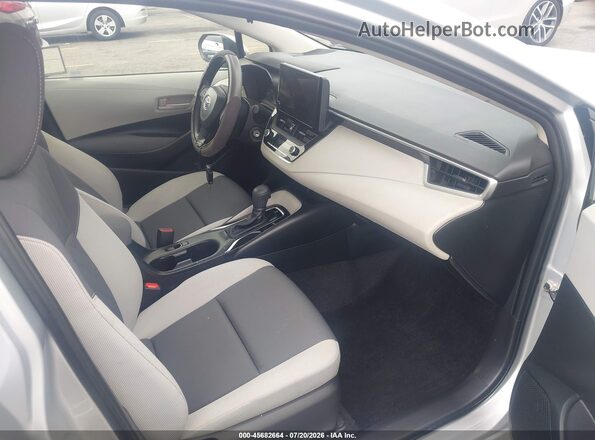 JTDB4MEE1P3014328 2023 TOYOTA COROLLA Silver Front interior view
